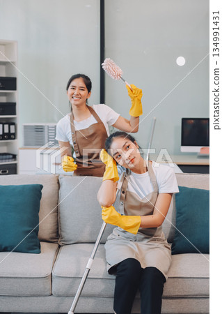 Cleaners clean empty office spaces Cleaners clean empty office spaces 134991431