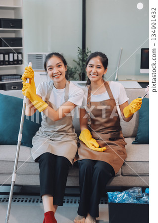 Cleaners clean empty office spaces Cleaners clean empty office spaces 134991432