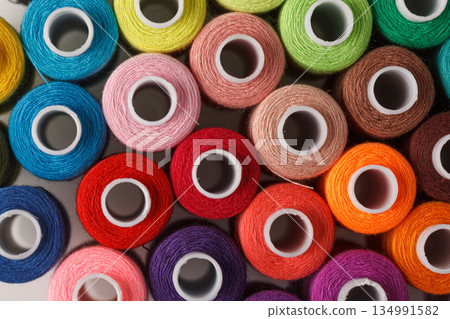 Set of colorful spools of thread 134991582