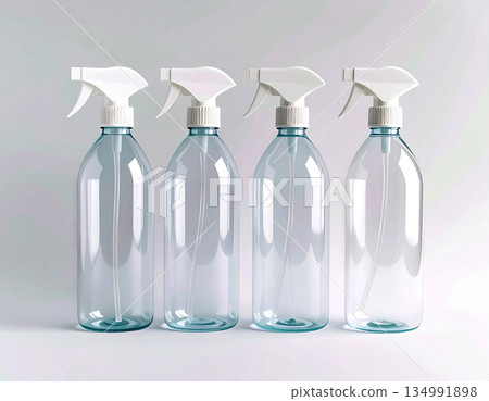 Home lifestyle appeal. Three transparent sprays in a row on a white background. Disinfectant, glass cleaner, all-purpose surface cleaner. Mockup for branding cleaning product. Home lifestyle appeal. Three transparent sprays in a row on a white background. Disinfectant, glass cleaner, all-purpose surface cleaner. Mockup for branding cleaning product. 134991898