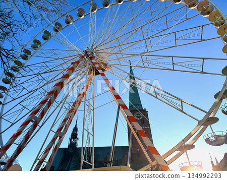 Urban Ferris wheel on sunny day Urban Ferris wheel on sunny day 134992293