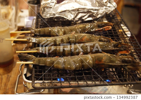 Large skewered shrimp grilled to perfection Large skewered shrimp grilled to perfection 134992387