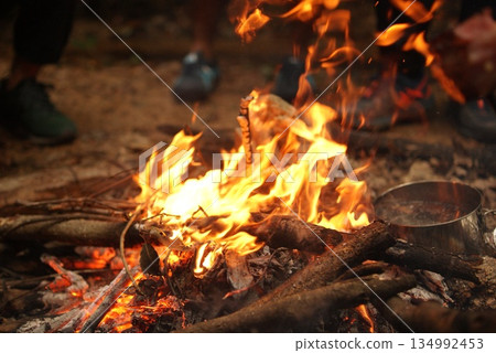 Burning bonfire and camp cooking flames 134992453