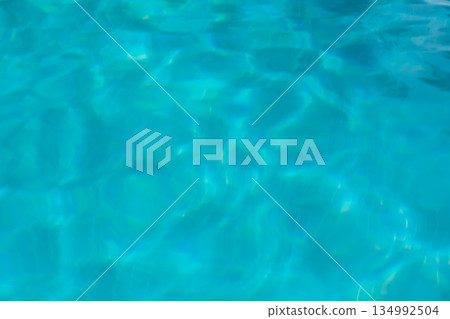 Pool water shimmers in the holiday sunlight, summer background Pool water shimmers in the holiday sunlight, summer background 134992504