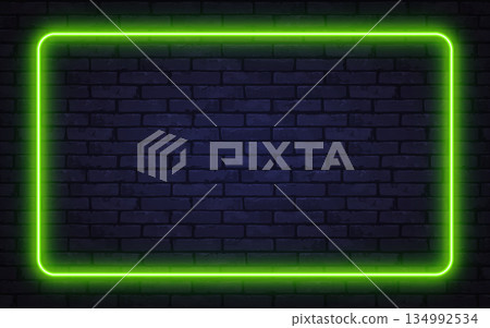 Glowing green neon frame on a dark brick wall creates a modern futuristic atmosphere. Perfect for digital ads, posters, or stylish presentations. 134992534