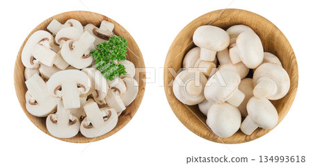 Fresh mushroom champignon slices in a wooden bowl isolated on white background. Top view. Flat lay Fresh mushroom champignon slices in a wooden bowl isolated on white background. Top view. Flat lay 134993618