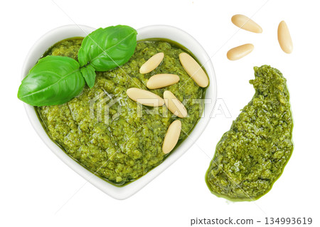 Pesto sauce in ceramic bowl isolated on white background. Top view. Flat lay. Pesto sauce in ceramic bowl isolated on white background. Top view. Flat lay. 134993619