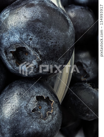 Macro Close-Up of Fresh Blueberries with Natural Texture 134993917