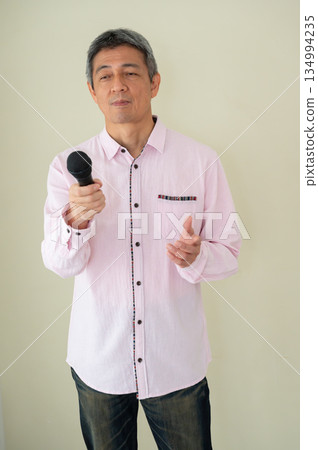 A man who speaks with a microphone A man who speaks with a microphone 134994235