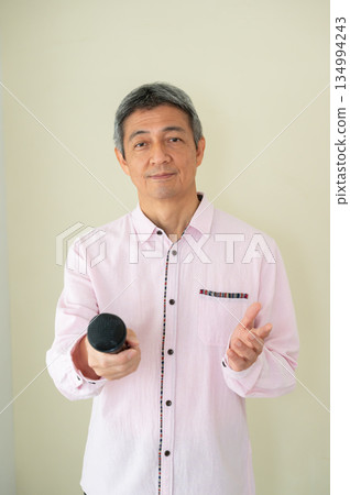 Man interviewing with microphone Man interviewing with microphone 134994243