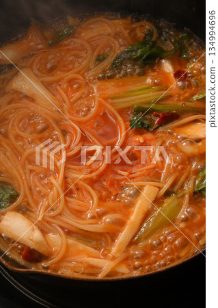 Cooking pasta with tomato sauce Cooking pasta with tomato sauce 134994696