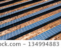 Solar energy farm with rows of photovoltaic panels 134994883