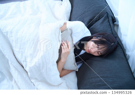 Scene of a young woman sleeping with her eyes closed Scene of a young woman sleeping with her eyes closed 134995326