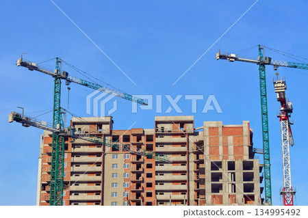 Construction industry.Large high rise crane, new building 134995492