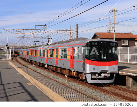 Sanyo Electric Railway 6000 series local train arriving at Onouematsu Station 134996202