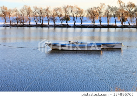 Two boats floating on the river 134996705