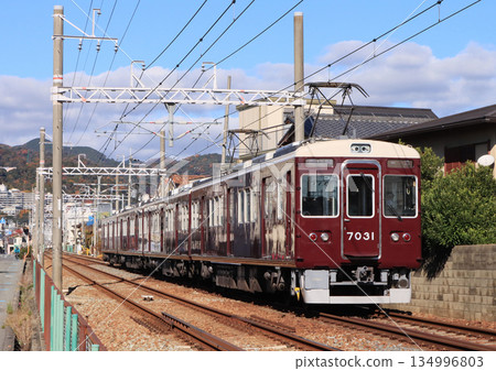 Hankyu Minoh Line 7000 series train running between Makiochi and Sakuraikan Hankyu Minoh Line 7000 series train running between Makiochi and Sakuraikan 134996803