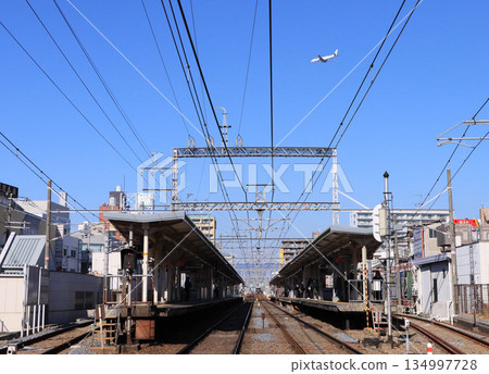 Hankyu Takarazuka Line Shonai Station and airplane 134997728