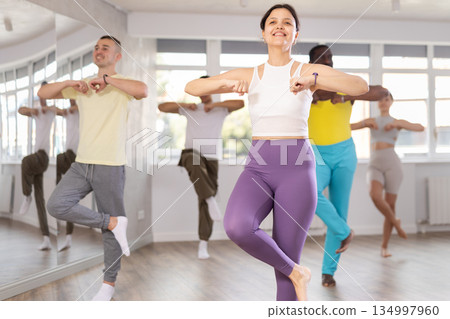 Young Asian woman practicing aerobic dance in training hall Young Asian woman practicing aerobic dance in training hall 134997960
