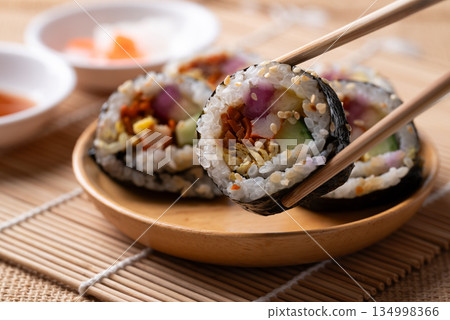 Kimbap, Korean food made from cooked rice with vegetables, egg and wrapped with dried seaweed Kimbap, Korean food made from cooked rice with vegetables, egg and wrapped with dried seaweed 134998366