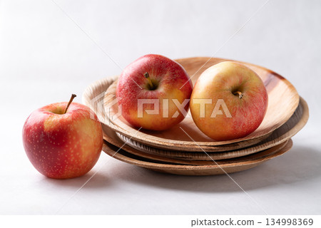 Red apple fruit (Gala apple) in natural plate on white background Red apple fruit (Gala apple) in natural plate on white background 134998369