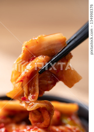 Kimchi cabbage with chopsticks, Korean food 134998376