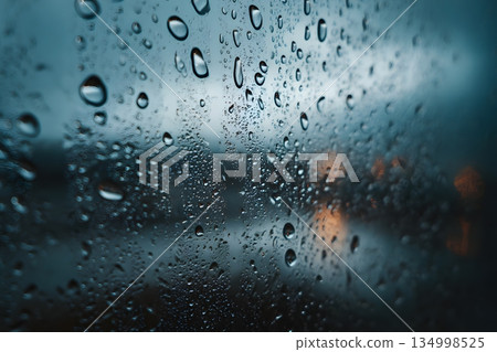 Raindrops falling on window glass Raindrops falling on window glass 134998525