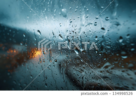 Raindrops falling on window glass 134998526
