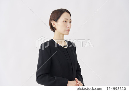 Woman in mourning clothes, portrait, white background Woman in mourning clothes, portrait, white background 134998810