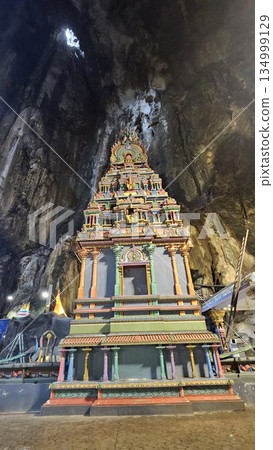 A vibrant Hindu temple bursts with color and sacred detail inside a cave A vibrant Hindu temple bursts with color and sacred detail inside a cave 134999129