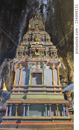 A vibrant Hindu temple bursts with color and sacred detail inside a cave A vibrant Hindu temple bursts with color and sacred detail inside a cave 134999131