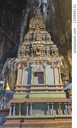A vibrant Hindu temple bursts with color and sacred detail inside a cave A vibrant Hindu temple bursts with color and sacred detail inside a cave 134999132