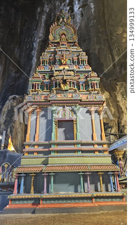 A vibrant Hindu temple bursts with color and sacred detail inside a cave A vibrant Hindu temple bursts with color and sacred detail inside a cave 134999133