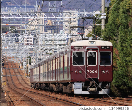 Hankyu Imazu-Kita Line 7000 series train running near Incheon Station Hankyu Imazu-Kita Line 7000 series train running near Incheon Station 134999236
