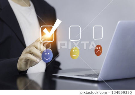 Customer Satisfaction Survey with Hand Selecting Happy Emoji on Digital Interface Customer Satisfaction Survey with Hand Selecting Happy Emoji on Digital Interface 134999350