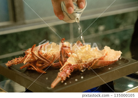 Grilled spiny lobster cooking in progress, sake 135000105