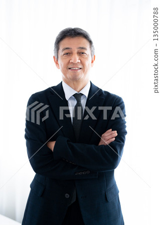 Senior man with a serious expression staring straight ahead 135000788