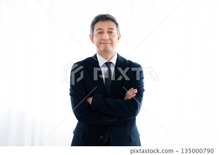 Senior man with a serious expression staring straight ahead 135000790