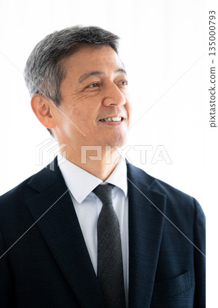 A manager with a confident and hopeful expression A manager with a confident and hopeful expression 135000793