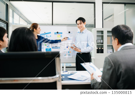 Business team discuss at meeting room. working together with laptop ,tablet and smart phone on desk Financial accountant , planner , meeting , introduction concept. At office 135000815