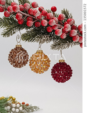 Handmade beaded Christmas balls hanging on festive tree Handmade beaded Christmas balls hanging on festive tree 135001572