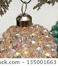 Handmade beaded Christmas ball. Cropped photo 135001663