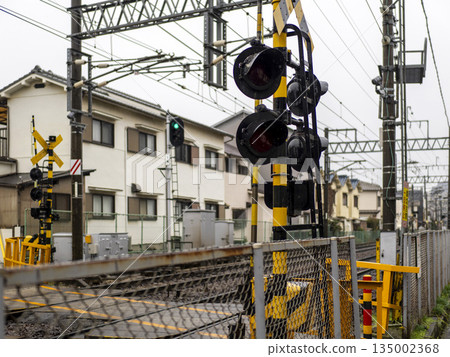Rain-soaked railroad crossing alarm 135002368