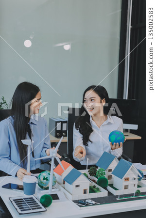 Hands of adult Asian business professionals analyzing ESG financial data and renewable energy project plans Hands of adult Asian business professionals analyzing ESG financial data and renewable energy project plans 135002583