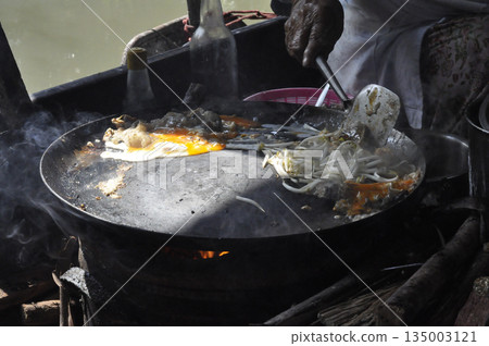 Street food frying pan egg bean sprout river Asian street food frying pan egg bean sprout river Asian vendor cooking delicious 135003121
