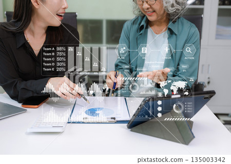 Project manager working and update tasks with milestones progress planning and professional investor working new start up project in the office. Project manager working and update tasks with milestones progress planning and professional investor working new start up project in the office. 135003342