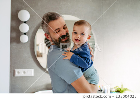 Father with little toddler son at home. Father with little toddler son at home. 135004025