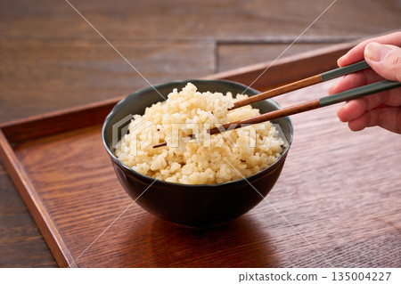 Brown rice served in a bowl Brown rice served in a bowl 135004227