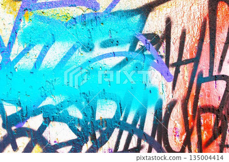 Abstract Urban Graffiti Wall with Blue, Orange, Purple Spray Paint for 2000s Street Art Style Abstract Urban Graffiti Wall with Blue, Orange, Purple Spray Paint for 2000s Street Art Style 135004414