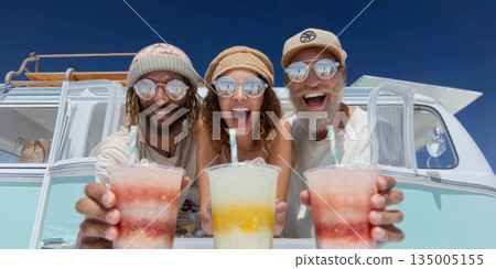 Young friends holding frozen drinks by vintage van, smiling under blue sky with sunglasses and straw hats, joyful summer road trip vibe 135005155
